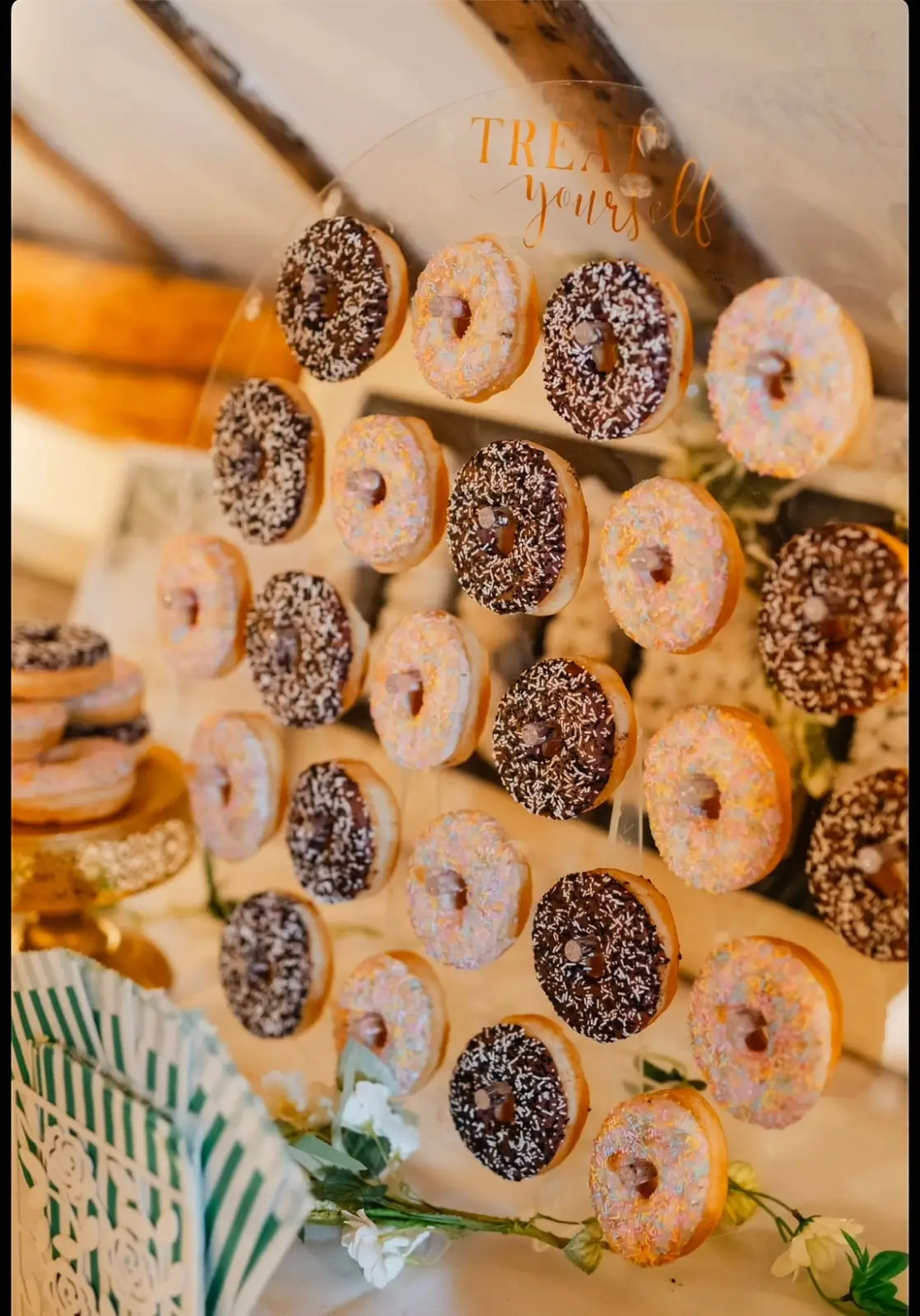 Trays of sugared and chocolate-topped donuts seen from above