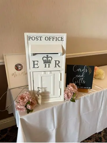 White Post Office style wedding post box with a Cards and Gifts sign and roses